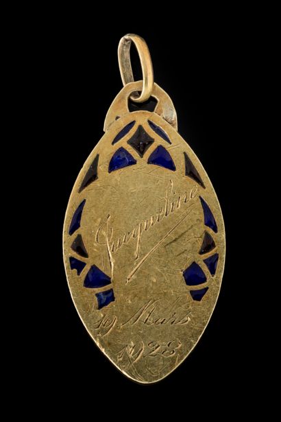 A diamond-shaped medal depicting the Virgin...