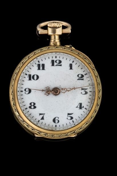 Small pocket or lapel watch with a yellow...