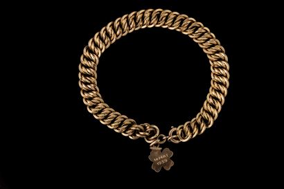 Yellow gold (750) curb chain bracelet adorned...