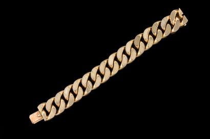 A substantial, wide yellow gold (750) link...