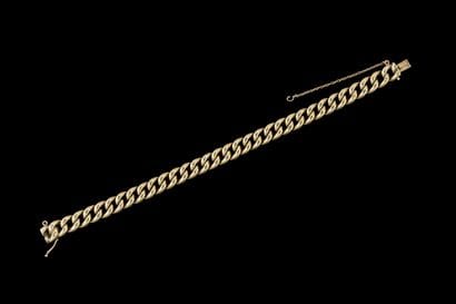 Yellow gold (750) curb chain bracelet. Rhinoceros...
