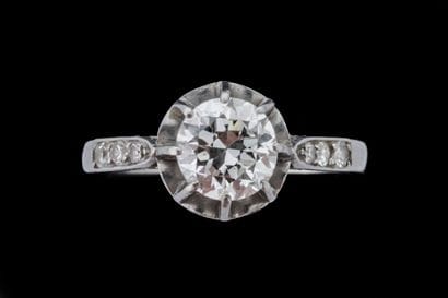 Solitaire ring set with an antique-cut diamond...