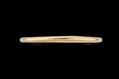 Oval, open-end bangle bracelet in yellow...