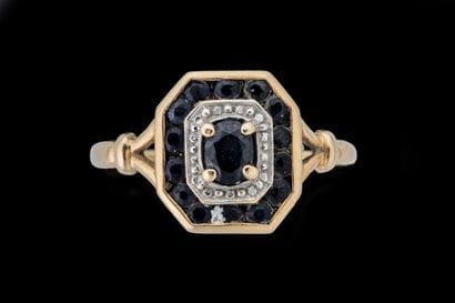 Small, curved rectangular ring in yellow...