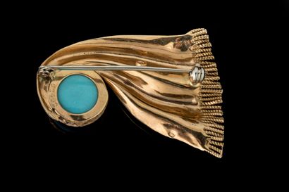 Vintage brooch featuring a draped trim design...