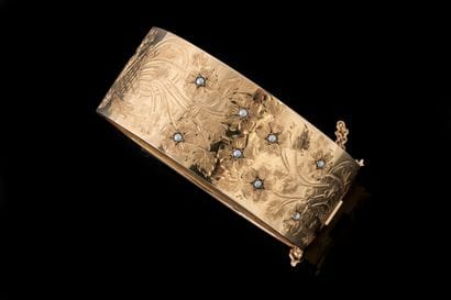 Wide, clasp-style bangle bracelet decorated...