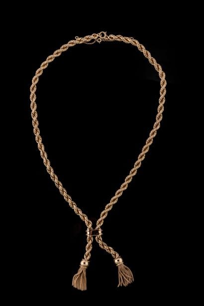 A loose-fitting necklace made of cord-style...