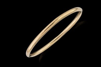 Oval, open-end bangle bracelet in yellow...