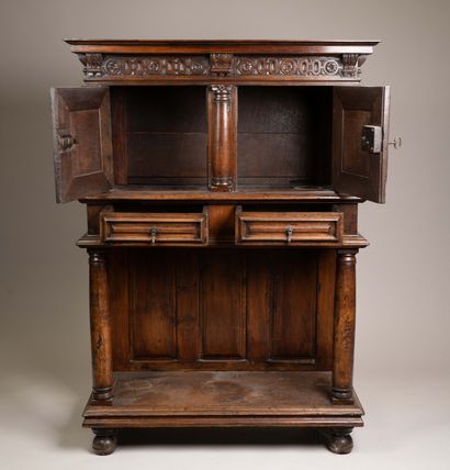 Molded and carved walnut sideboard, decorated...