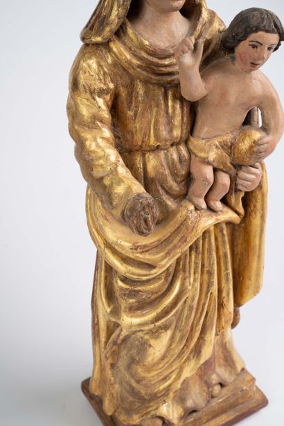 Carved, polychrome, and gilded wooden Virgin...