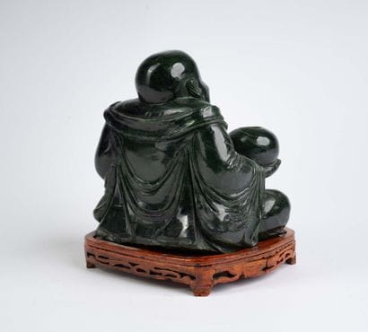 CHINA, 20th century 
Dark green jadeite Buddha...