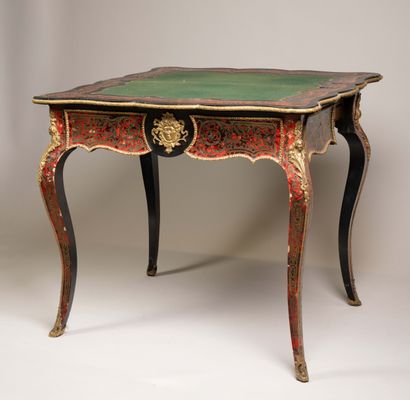 Game table with a broken-shaped top in blackened...