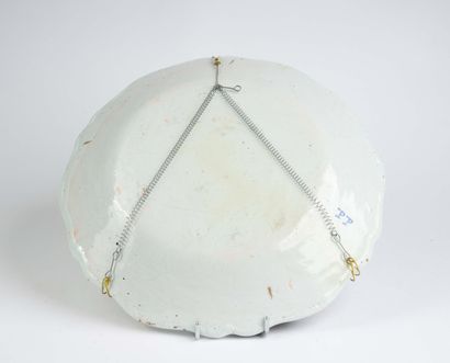 Large earthenware dish with a scalloped edge...