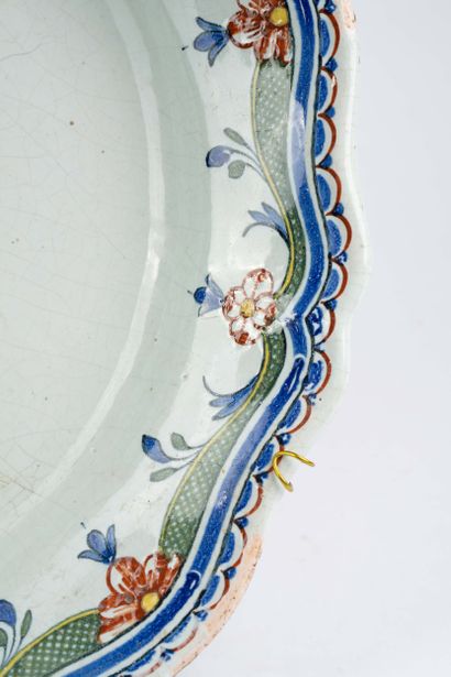 Large earthenware dish with a scalloped edge...