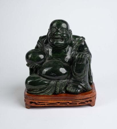 CHINA, 20th century 
Dark green jadeite Buddha...