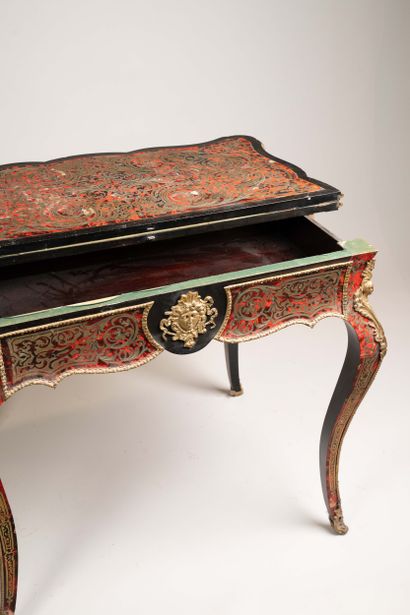 Game table with a broken-shaped top in blackened...