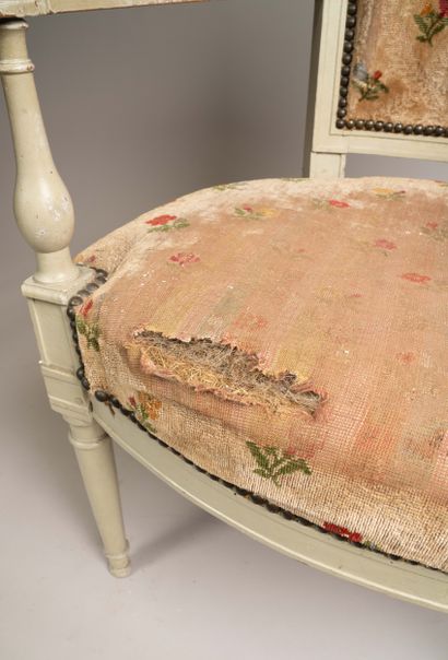 Armchair with a trapezoidal cabriolet backrest...