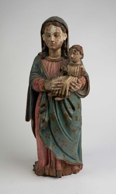 Vierge à l’Enfant en noyer sculpté et polychromé....