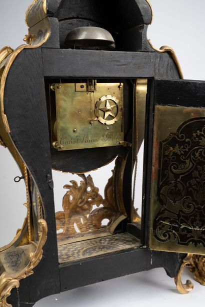 Wall sconce with a violin-shaped console...