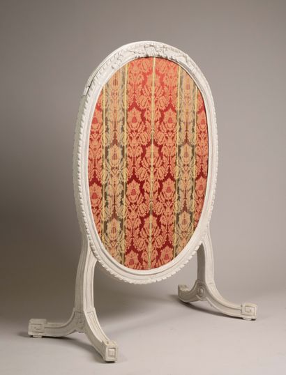A medallion-shaped mantelpiece made of molded,...