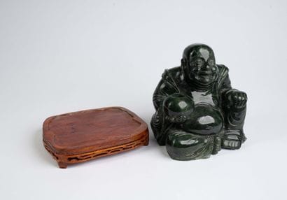 CHINA, 20th century 
Dark green jadeite Buddha...