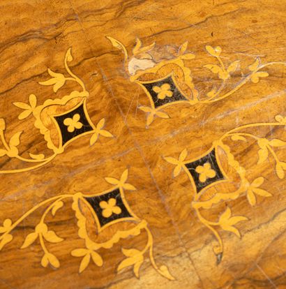 A light-colored wood and veneer coffee table...