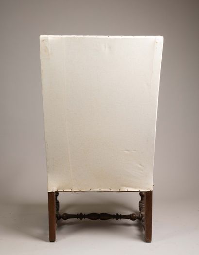 Armchair with a flat, quadrangular high back...