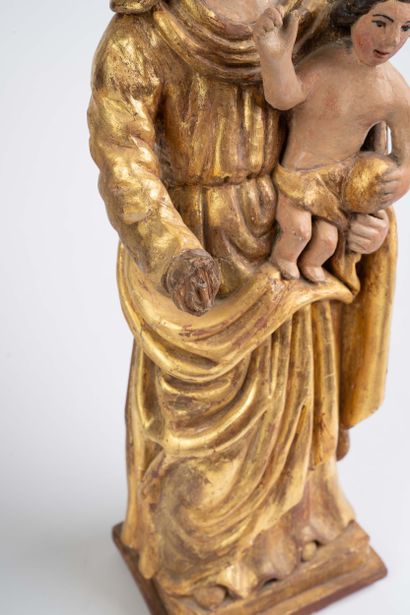 Carved, polychrome, and gilded wooden Virgin...