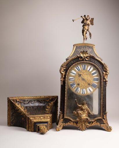 Wall clock with a brown tortoiseshell-veneered...