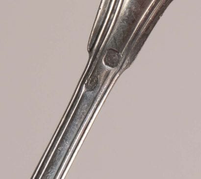 Set of 17 small silver spoons, marked with...