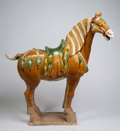 Pair of polychrome ceramic horse statues...