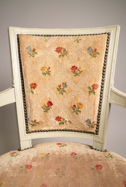Armchair with a trapezoidal cabriolet backrest...
