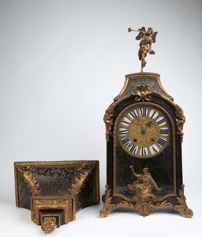Wall clock with a brown tortoiseshell-veneered...