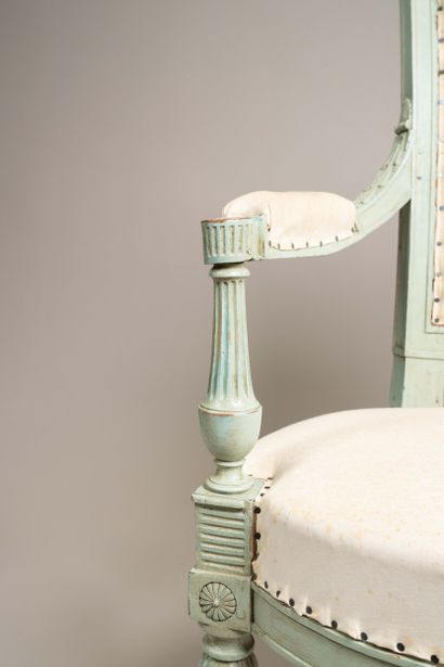 Armchair with a cabriolet back made of molded...