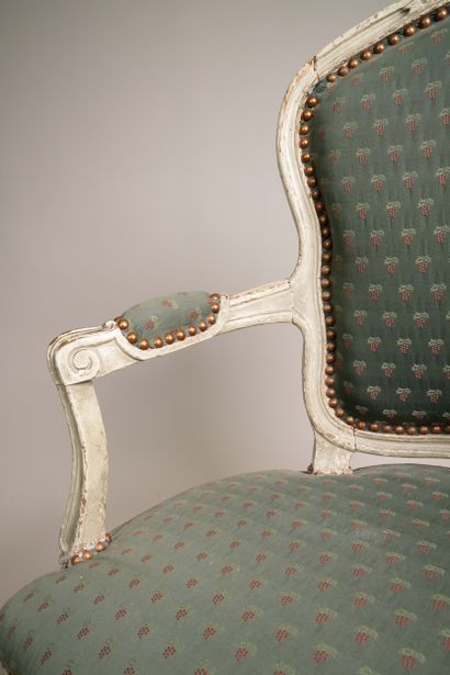 Armchair with a cabriolet back made of molded,...
