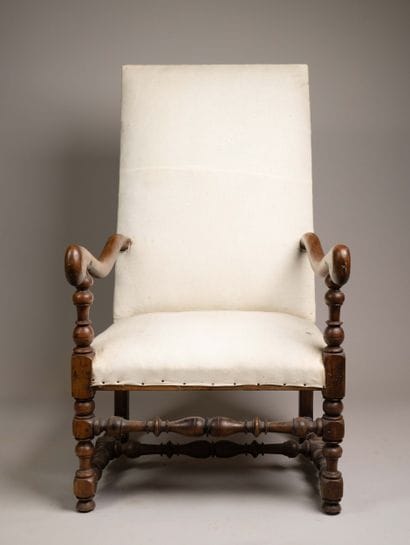 Armchair with a flat, quadrangular high back...