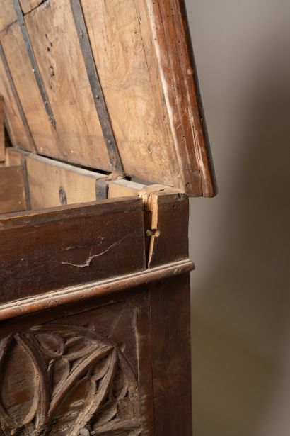 A quadrangular chest made of molded and carved...
