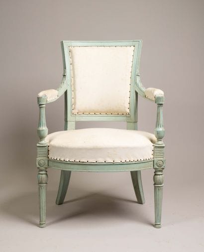 Armchair with a cabriolet back made of molded...