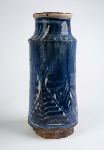 Earthenware albarello with blue flamed decoration....