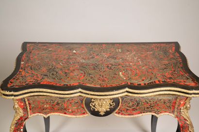 Game table with a broken-shaped top in blackened...