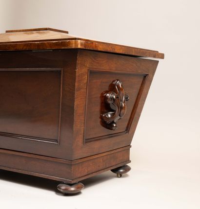 A bottle cooler in the shape of a sarcophagus,...