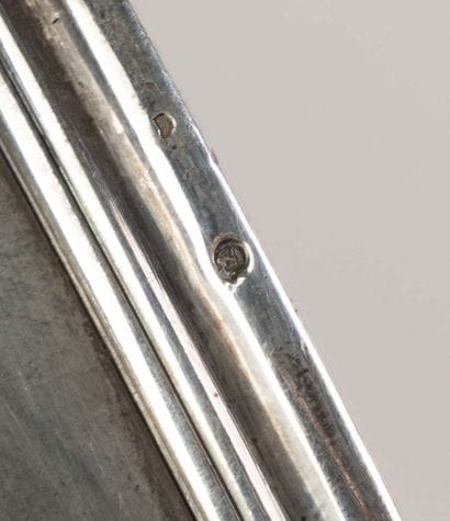 Silver utensil with a plain body and a laminated...