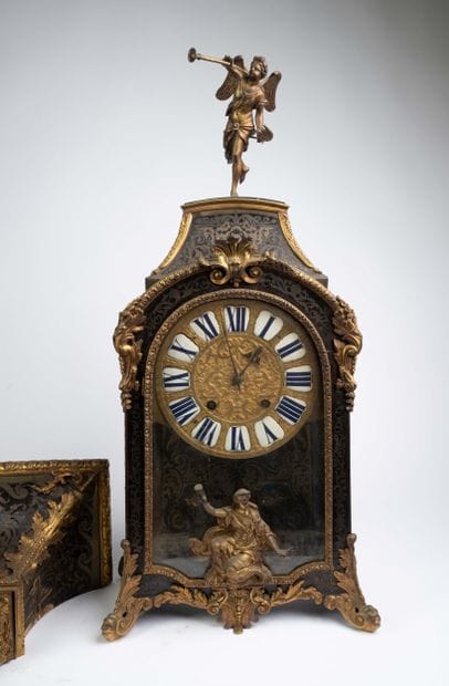 Wall clock with a brown tortoiseshell-veneered...