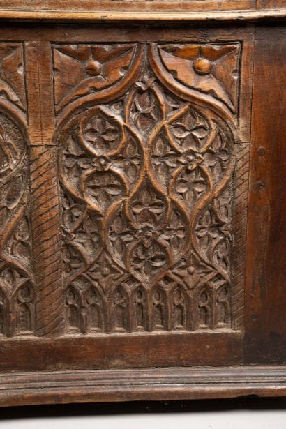 A quadrangular chest made of molded and carved...