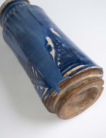 Earthenware albarello with blue flamed decoration....