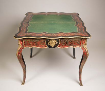 Game table with a broken-shaped top in blackened...