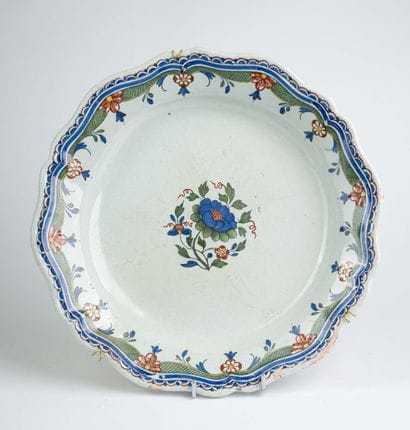 Large earthenware dish with a scalloped edge...