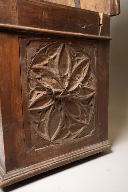 A quadrangular chest made of molded and carved...