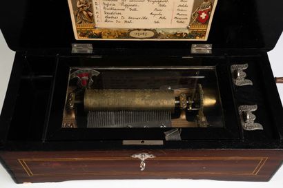 Rectangular wooden music box decorated with...