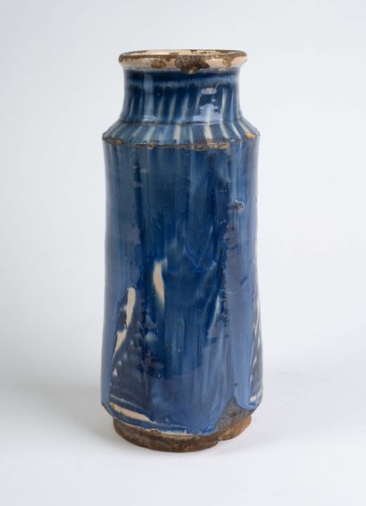 Earthenware albarello with blue flamed decoration....